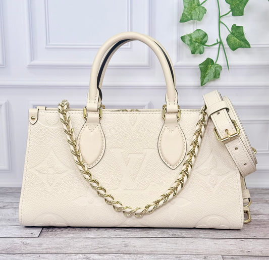 Louis Vuitton Empreinte Leather On The Go East West (Cream) - Like New